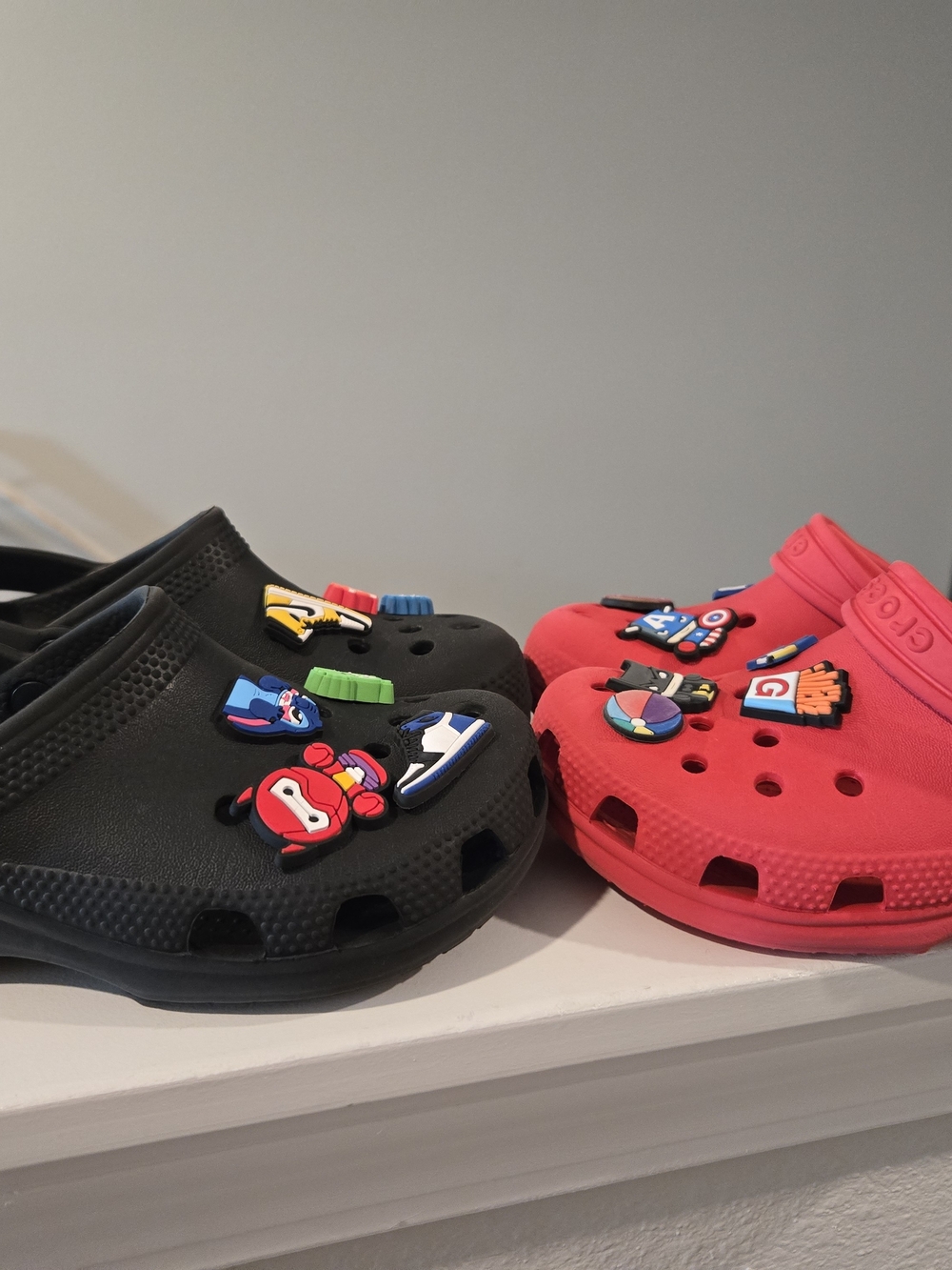 2 Pair Of Crocs Shoes 1 Black and 1 Red with Jibbitz Size 13